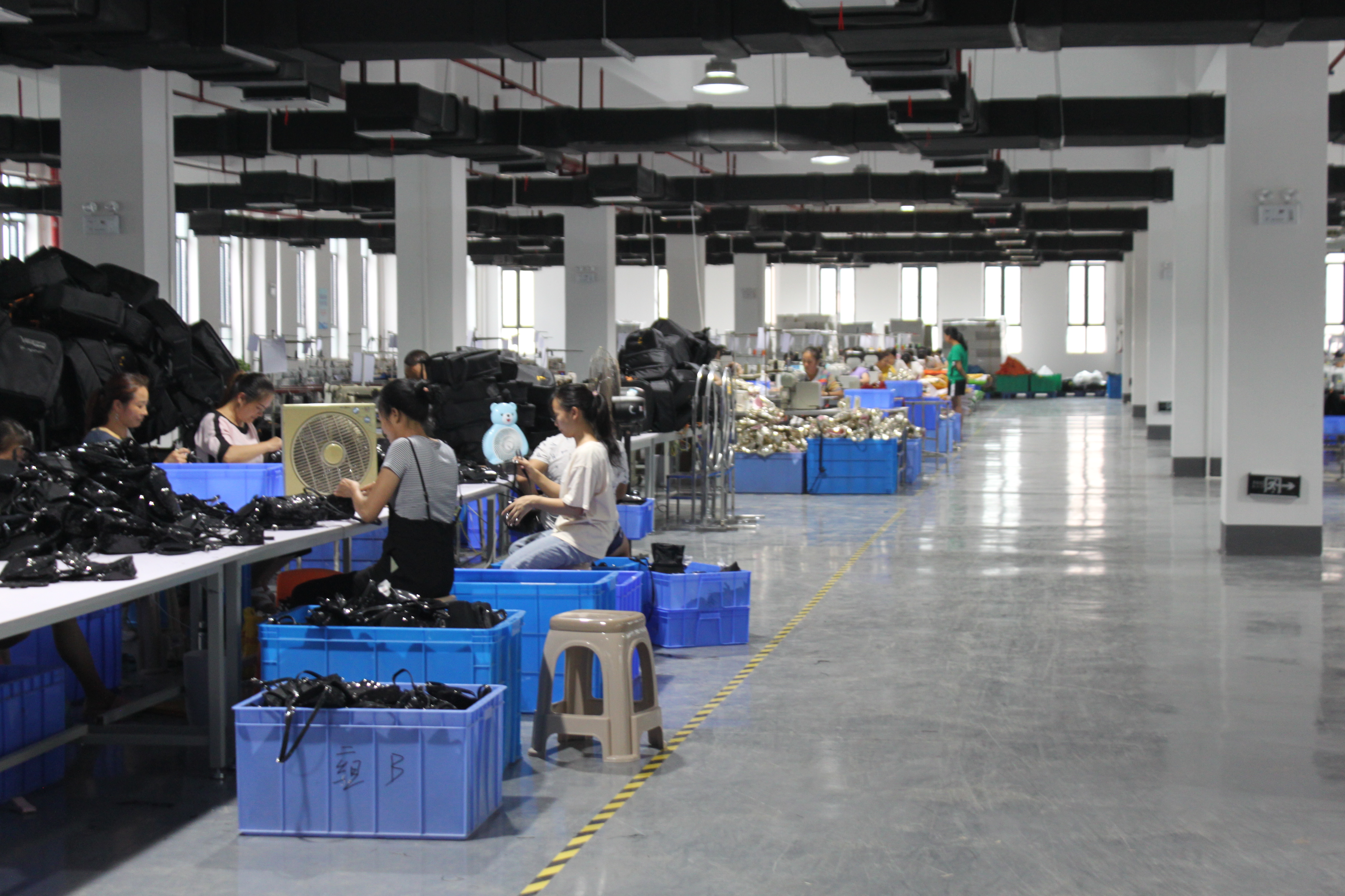 Wide view of FUYUAN cosmetic bag production floor showing scale of in-house capacity for OEM orders